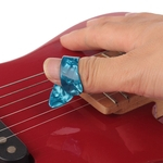 Ficha técnica e caractérísticas do produto Thumb guitarra Dedo Escolha Mediador Celluloid Thumbpick para acústica elétrica Guitarra cor aleatória Peças para guitarra